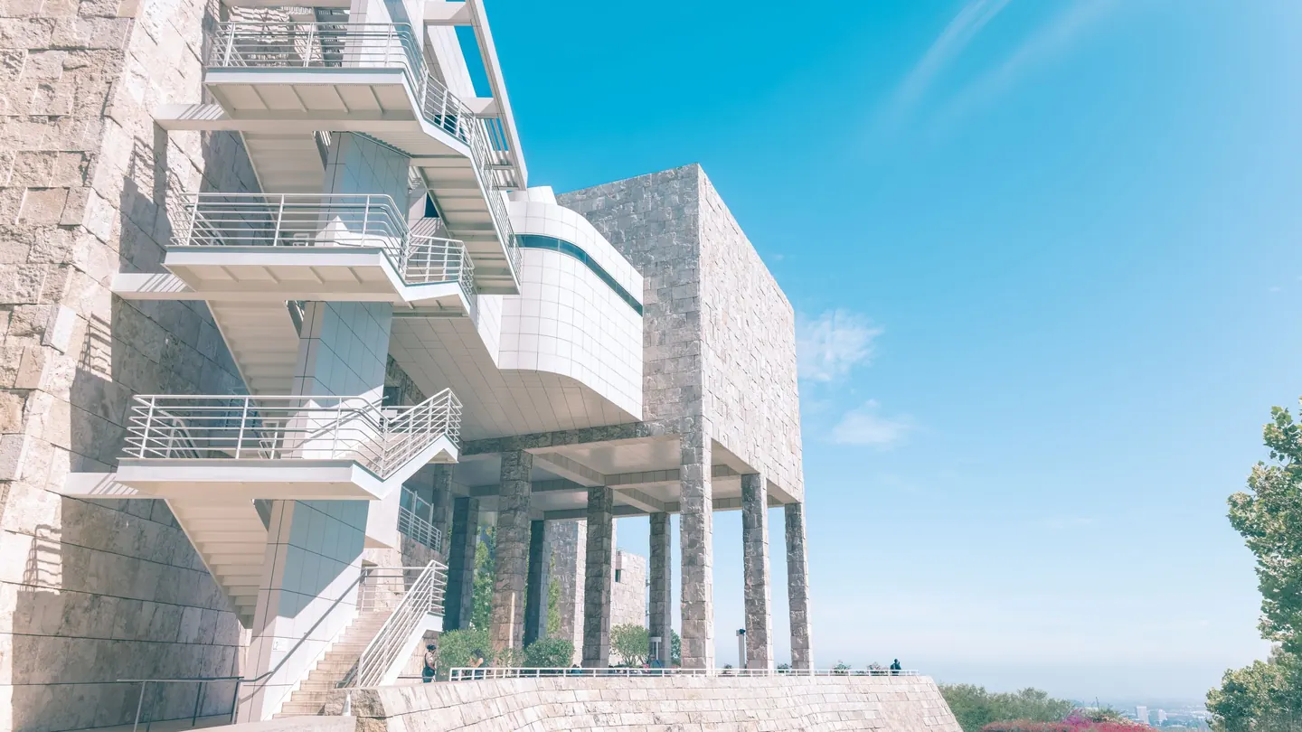 The white travertine architecture of the Getty Center in Brentwood under a blue sky