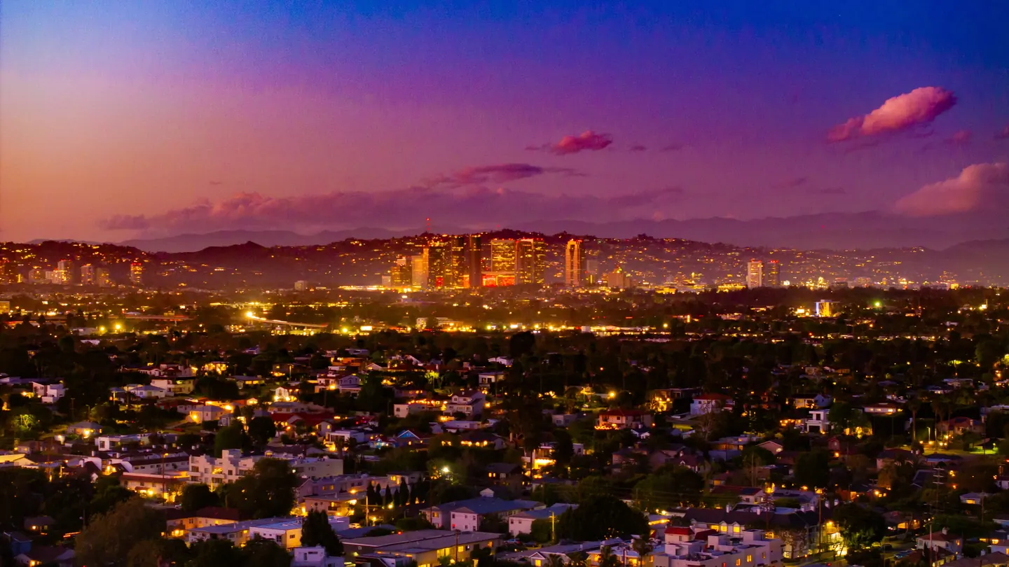 Century City's towers glowing at sunset above the Westside, seen from the air