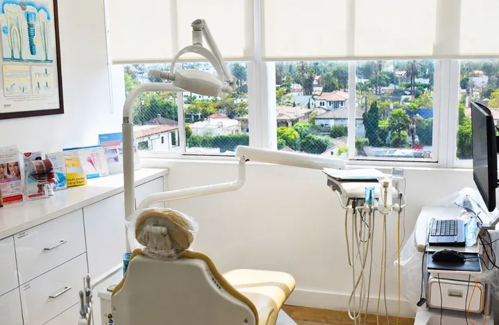 Treatment room with the chair under a window over Beverly Hills